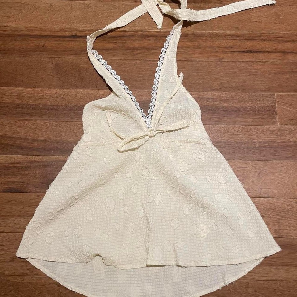Rusty white halter top with lace trim and bow detail, size M